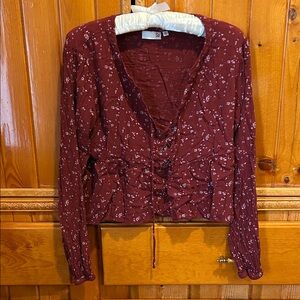 Cropped peplum lace up top